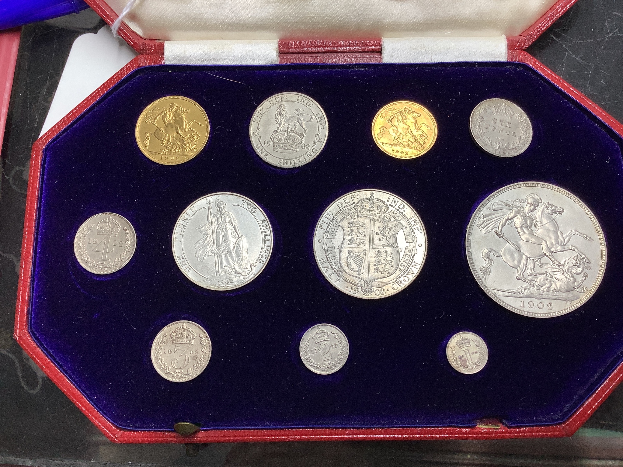 A cased Edward VII eleven-coin specimen set, matt surface, 1902, full gold sovereign through to Maundy 1d, hairlines otherwise near FDC
